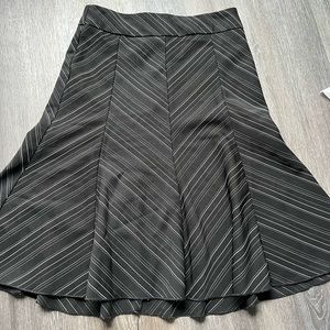 Black striped A-line skirt knee length.  Sz M